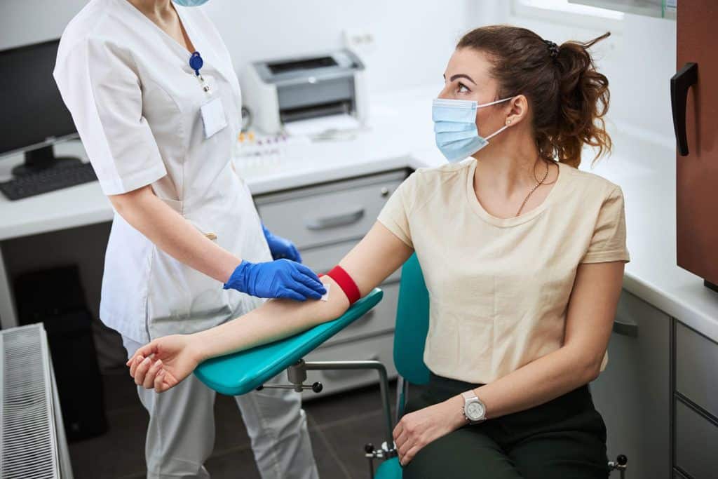 woman getting blood drawn at Alexandria Women's Center - 4d ultrasound - infertility treatment